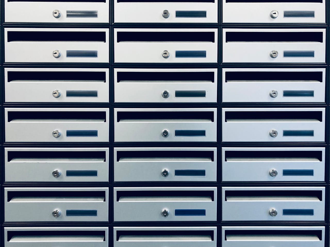 about-01 Array of silver mailboxes arranged in rectangular patterns, Geel, Belgium.